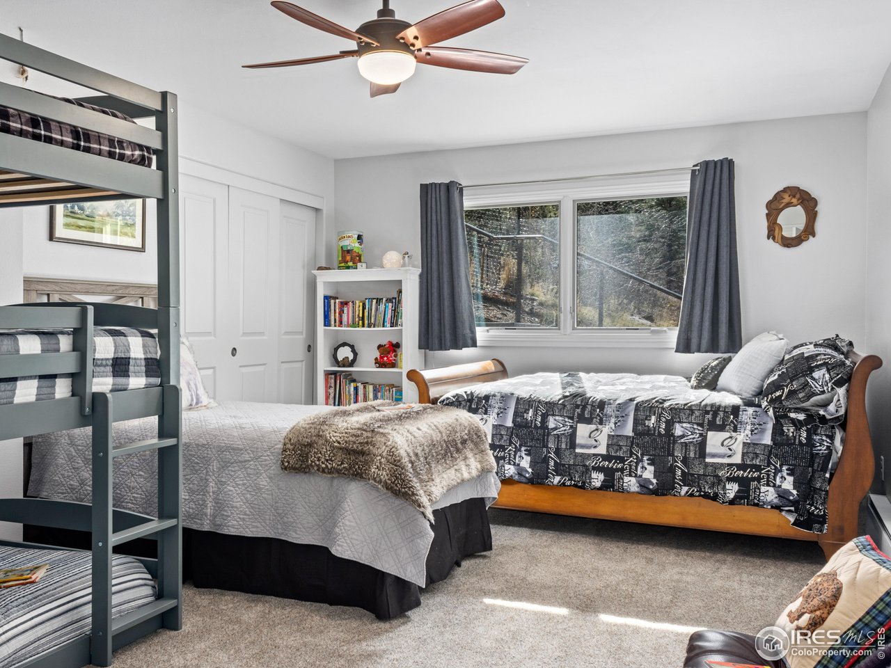 1267 Upper Venner Road Estes Park, CO 80517 - Photo 23 of 44 a bedroom with a bed and a window