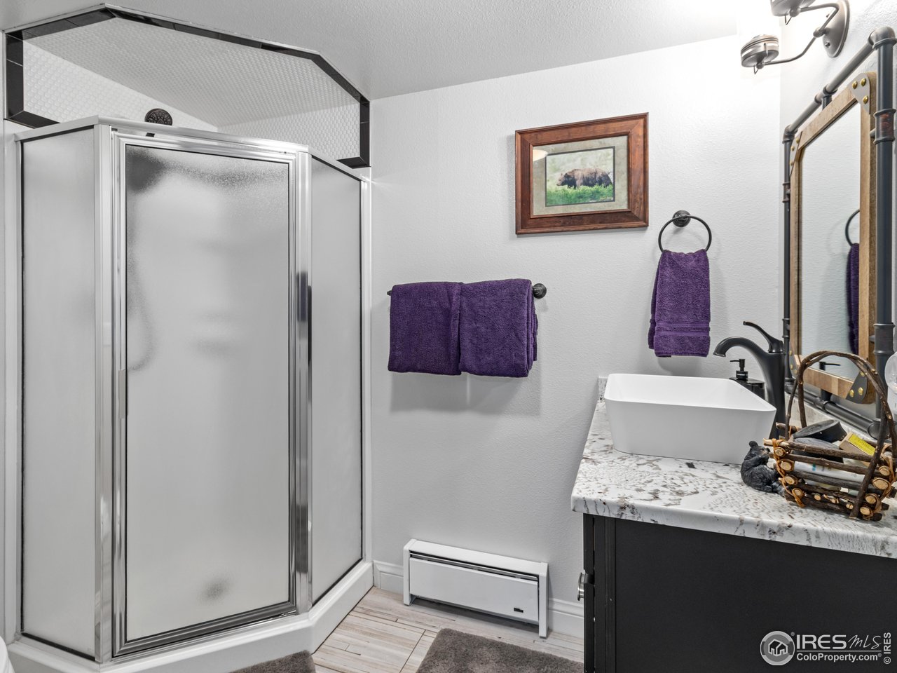 1267 Upper Venner Road Estes Park, CO 80517 - Photo 27 of 44 a bathroom with a sink and a mirror