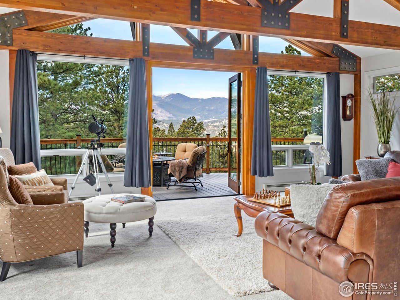 1267 Upper Venner Road Estes Park, CO 80517 - Photo 42 of 44 a living room with furniture and a large window
