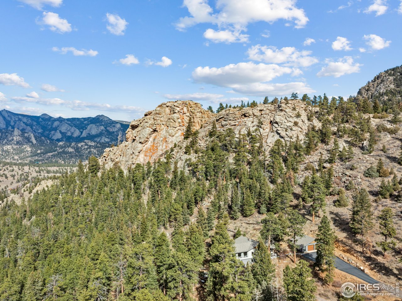 1267 Upper Venner Road Estes Park, CO 80517 - Photo 33 of 44 Nestled in the trees and rock-outcroppings sits a magical property