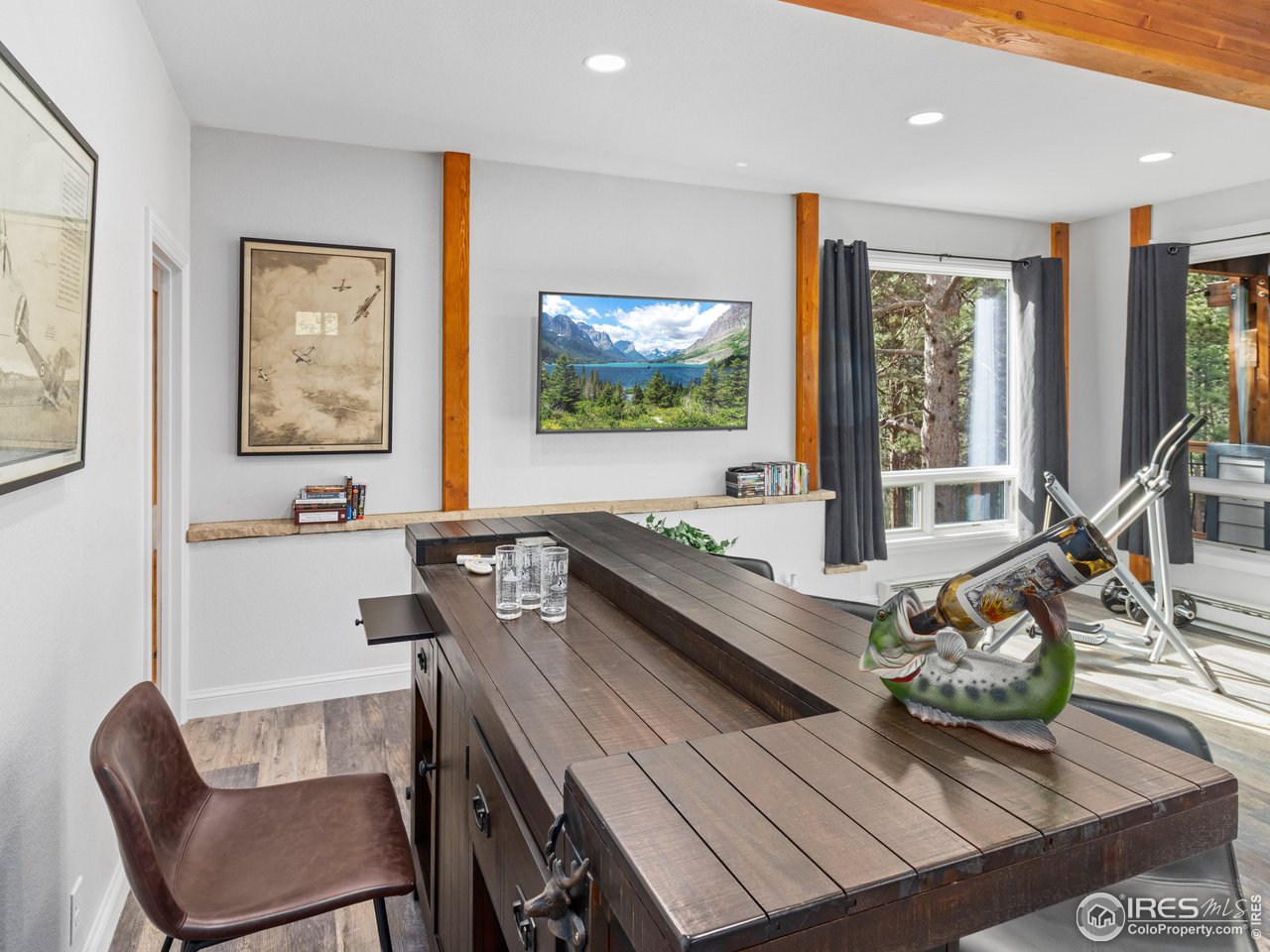 1267 Upper Venner Road Estes Park, CO 80517 - Photo 40 of 44 a view of a dining room with furniture window and outside view