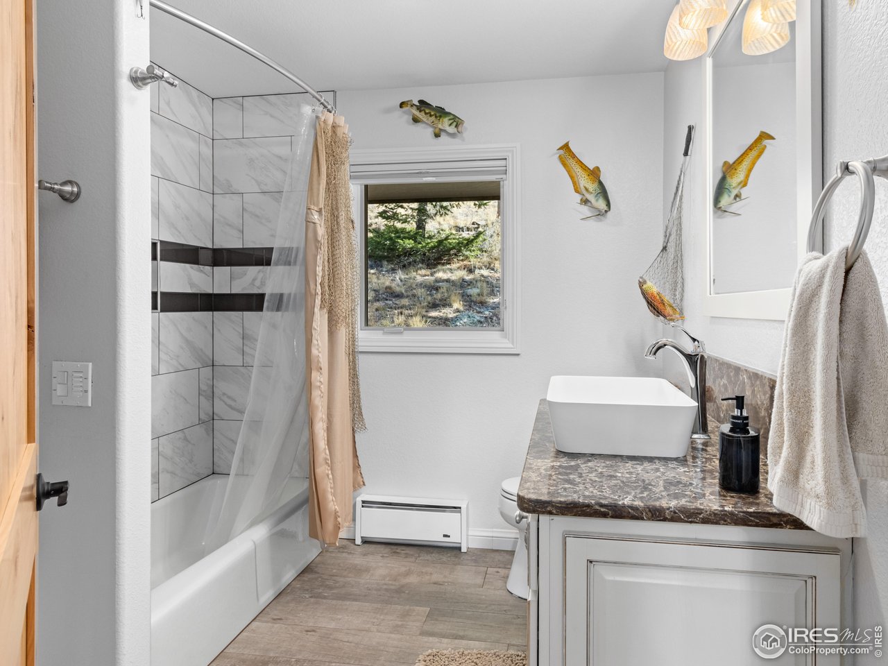 1267 Upper Venner Road Estes Park, CO 80517 - Photo 41 of 44 a bathroom with a granite countertop sink and a shower