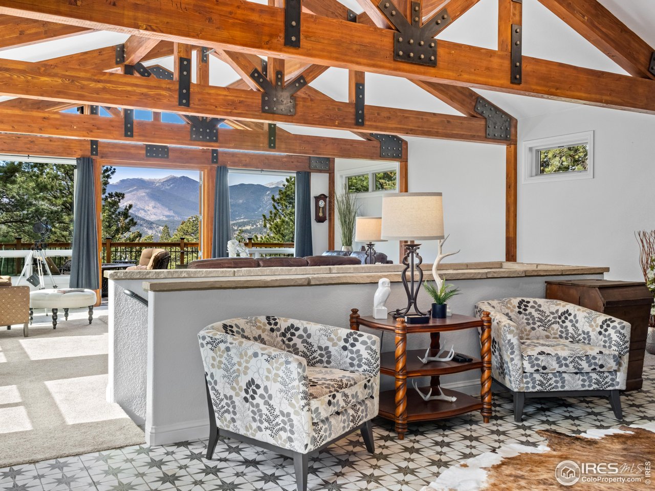 1267 Upper Venner Road Estes Park, CO 80517 - Photo 5 of 44 a view of a living room and a wooden floor