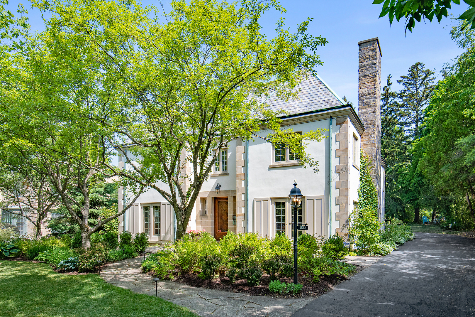 833 Kimball Road Highland Park, IL 60035 - Photo 1 of 29 front view of a house with a tree