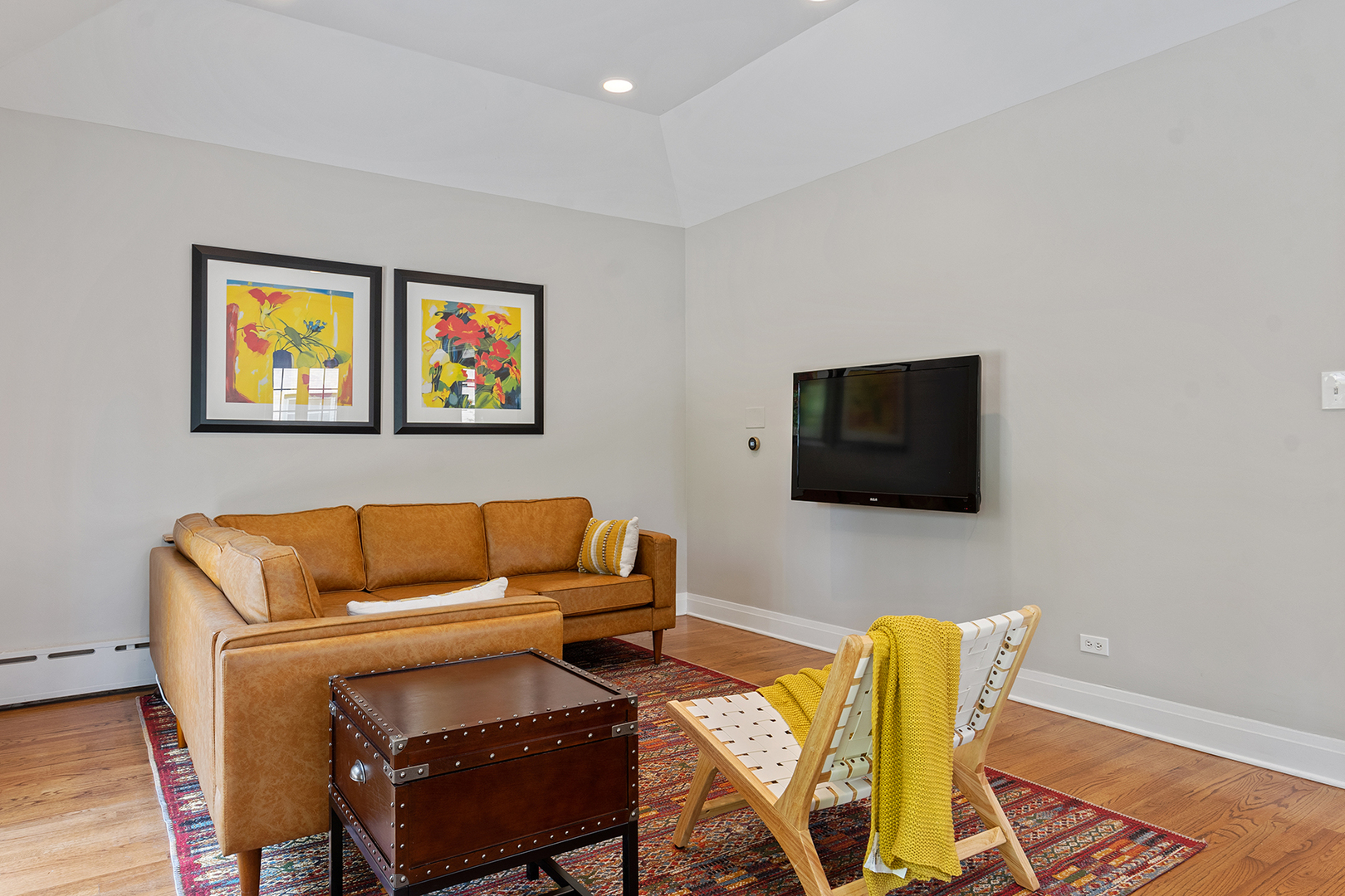 833 Kimball Road Highland Park, IL 60035 - Photo 12 of 29 a living room with furniture and a flat screen tv