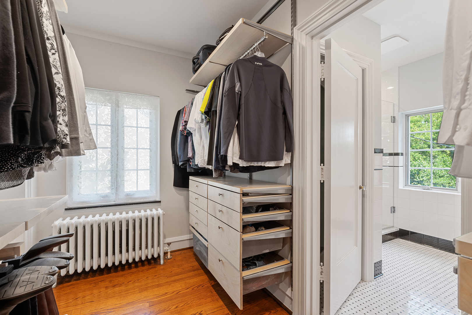 833 Kimball Road Highland Park, IL 60035 - Photo 15 of 29 a view of walk in closet with clothes and shoes