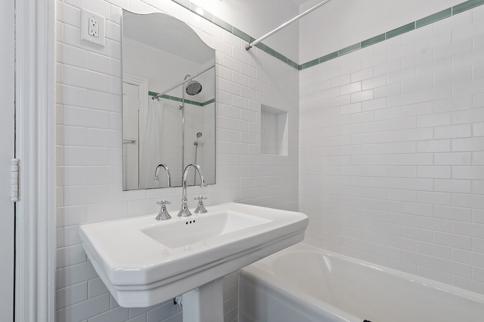 833 Kimball Road Highland Park, IL 60035 - Photo 19 of 29 a bathroom with a sink a mirror and a shower