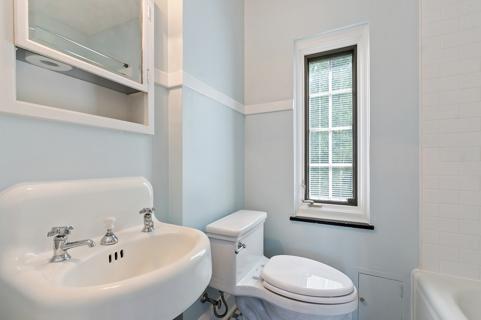 833 Kimball Road Highland Park, IL 60035 - Photo 23 of 29 a bathroom with a sink a toilet and a mirror