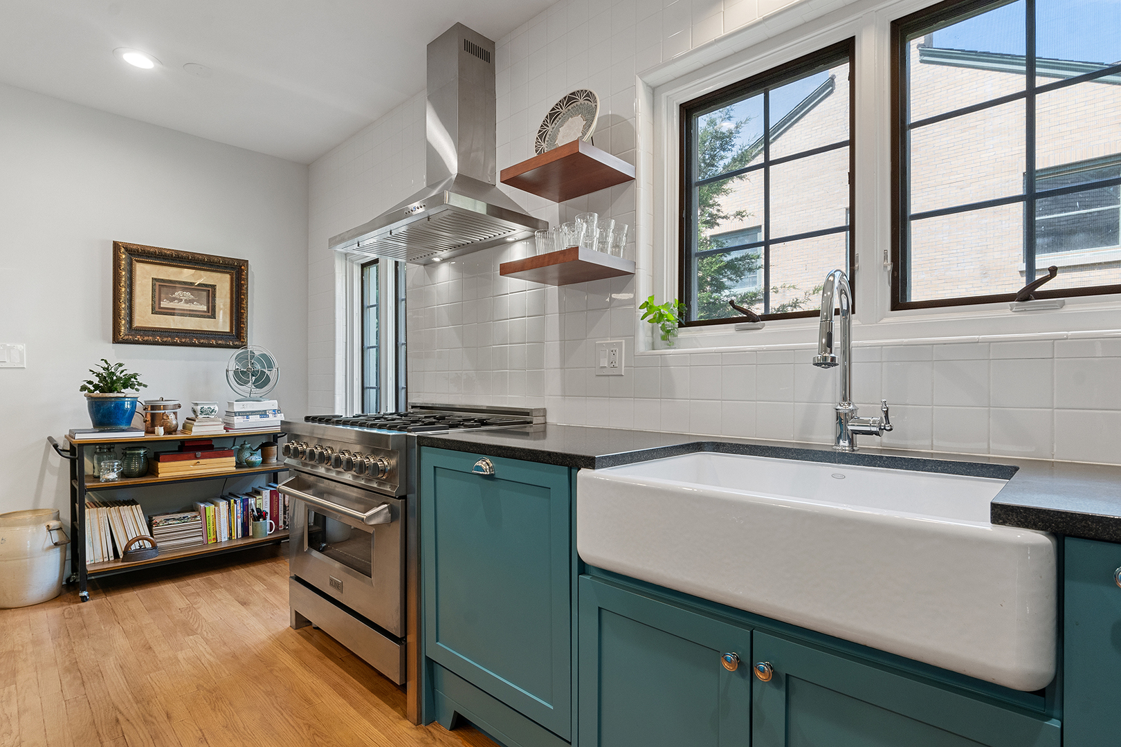 833 Kimball Road Highland Park, IL 60035 - Photo 5 of 29 a kitchen with stainless steel appliances granite countertop a sink and a stove next to a window