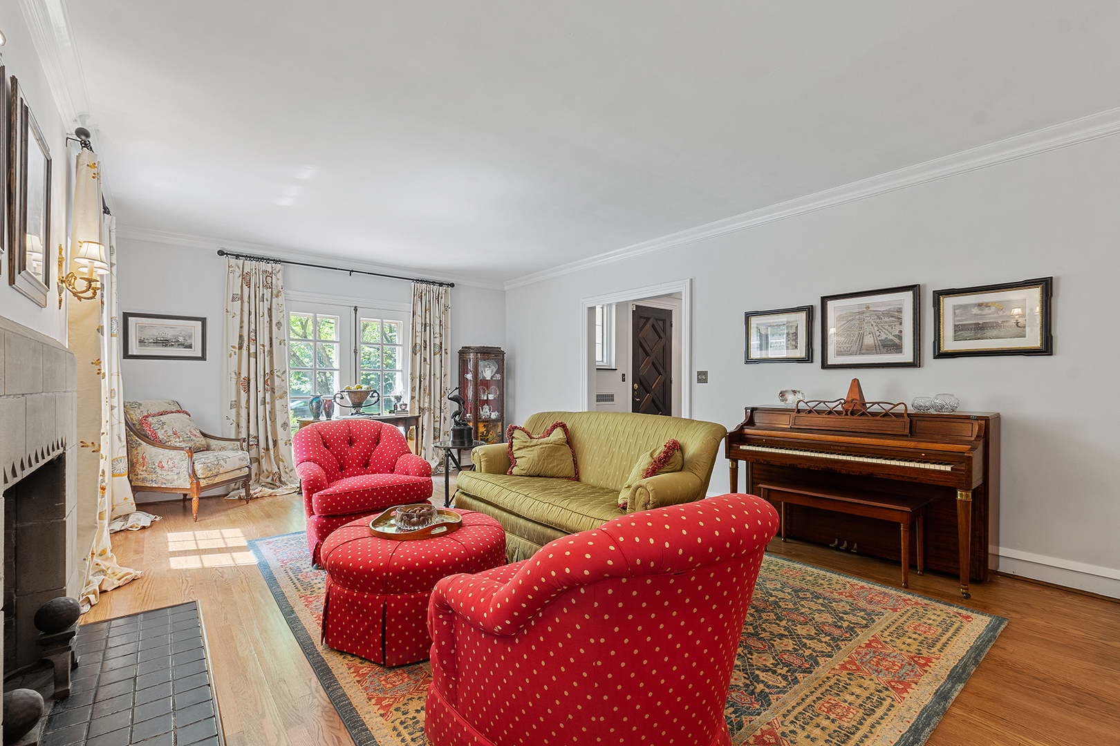833 Kimball Road Highland Park, IL 60035 - Photo 7 of 29 a living room with furniture a fireplace and a wooden floor