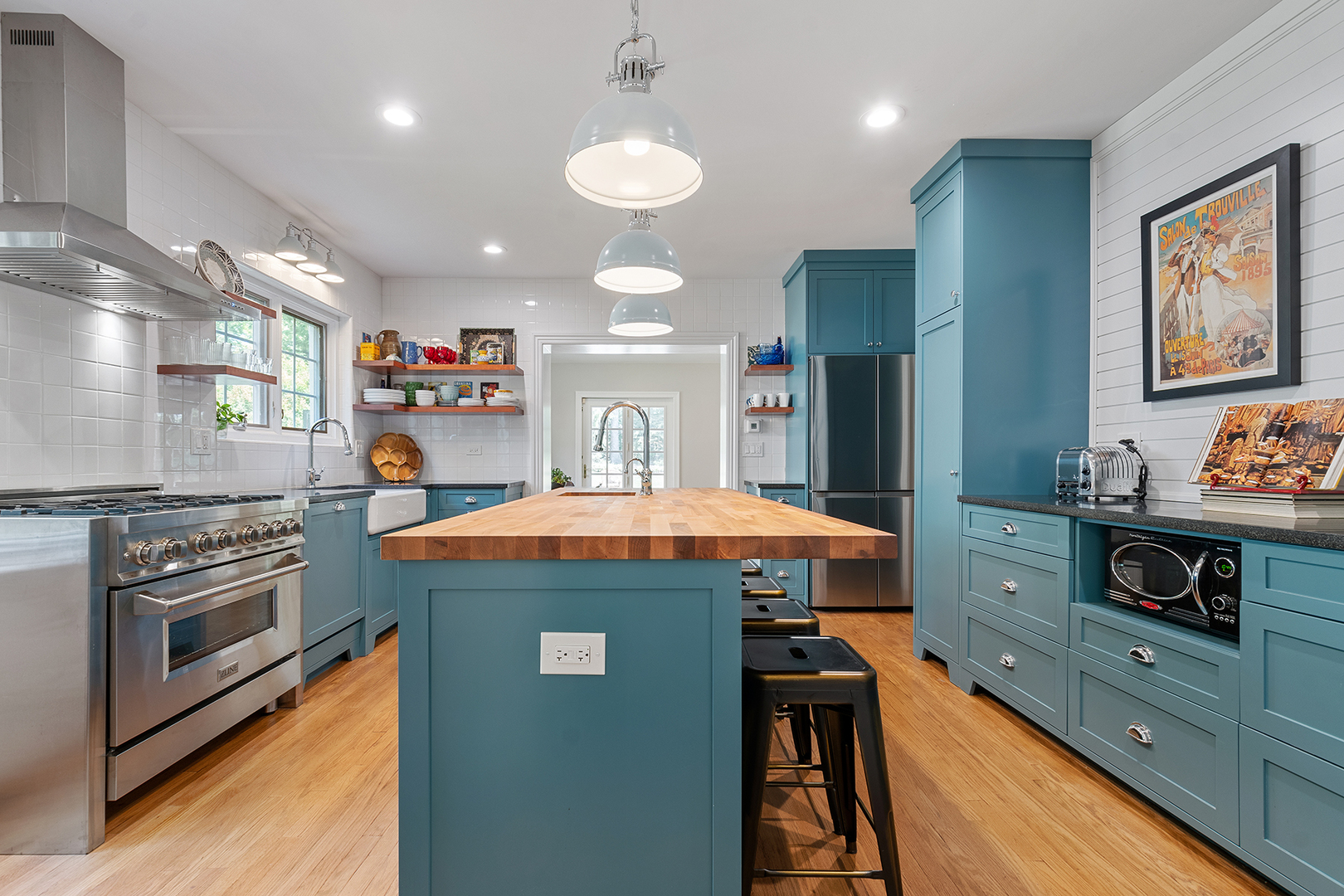 833 Kimball Road Highland Park, IL 60035 - Photo 9 of 29 a kitchen with kitchen island stainless steel appliances wooden floor dining table and chairs