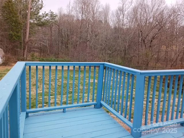 a view of a balcony with wooden floor