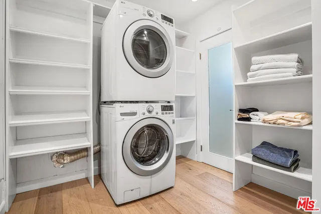 a utility room with sink dryer and washer