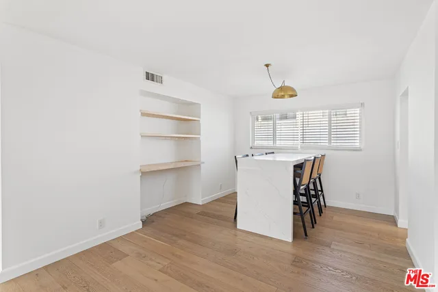 a view of a kitchen with a sink and a window