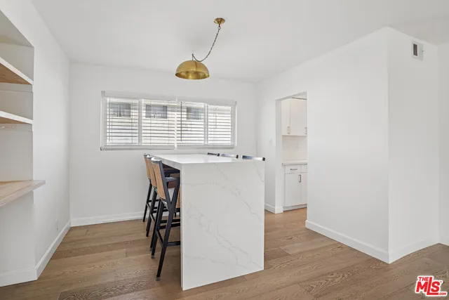 a view of workspace with wooden floor and window