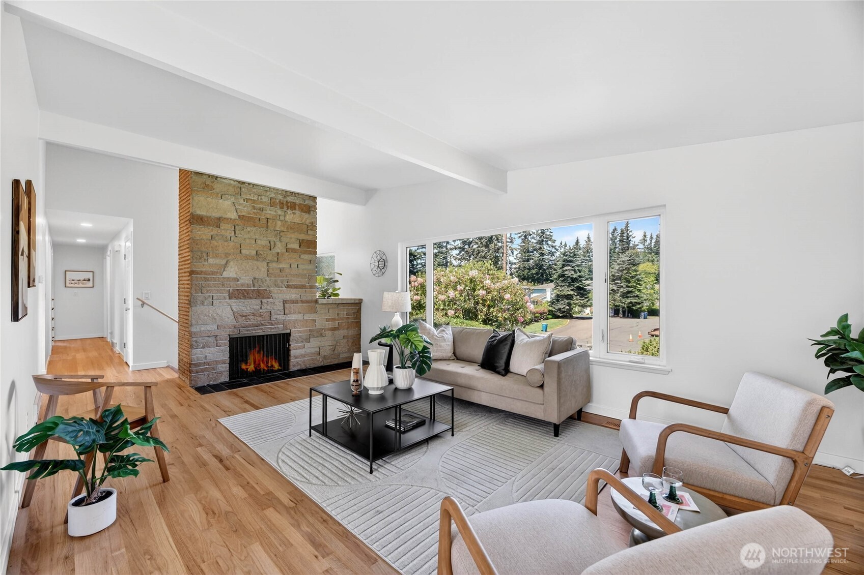 9114 207th Place Southwest Edmonds, WA 98026 - Photo 4 of 36 a living room with furniture fireplace and a large window