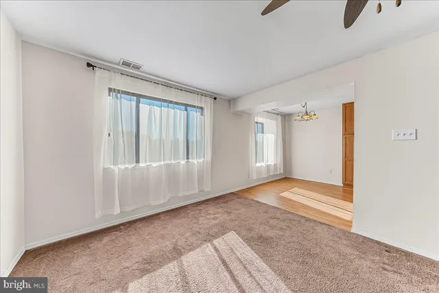 a view of a hallway with a white walls