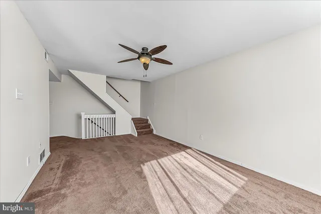 a kitchen with stainless steel appliances granite countertop a refrigerator a stove and a sink