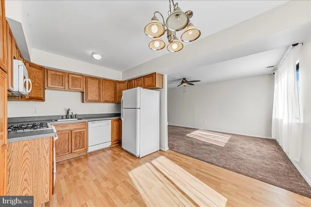 a kitchen with stainless steel appliances a stove a microwave and cabinets