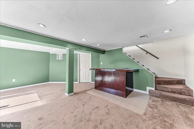 a view of a hallway with staircase