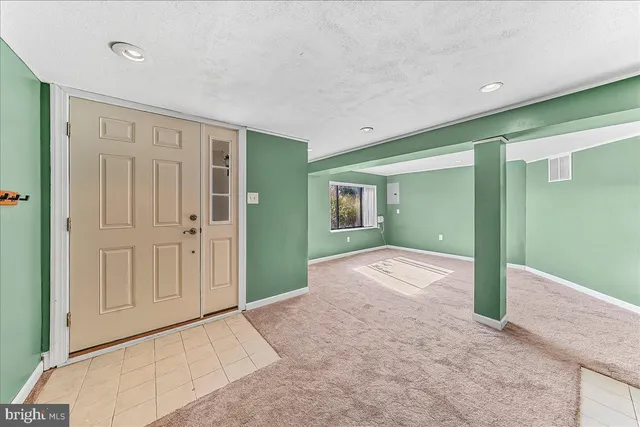 a view of a hallway with wooden shelves