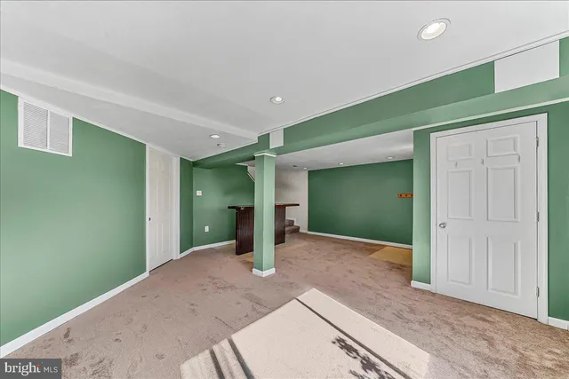 a view of a hallway with stairs