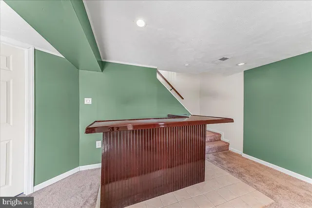 a view of room with a ceiling fan and window