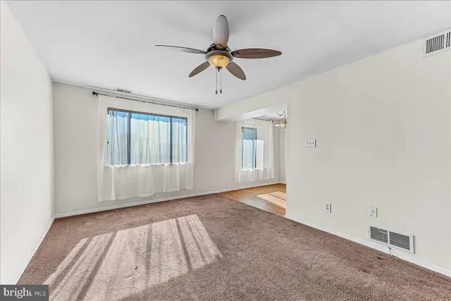 a view of a livingroom with a ceiling fan