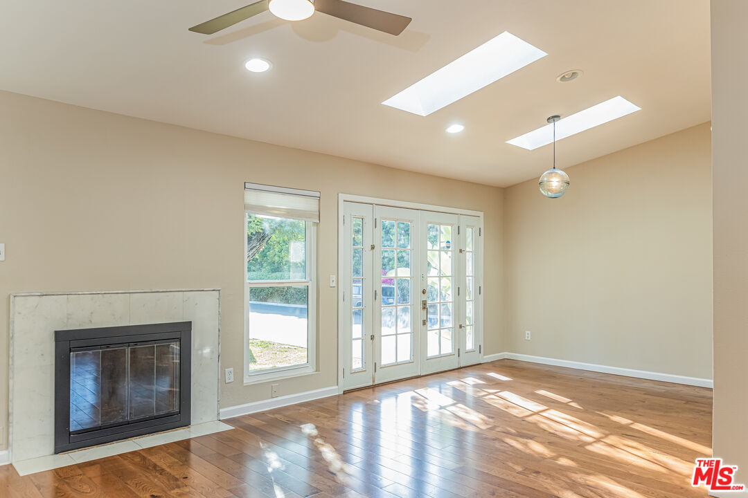 2 Tortoise Shell Irvine, CA 92604 - Photo 11 of 27 a view of an empty room with a fireplace and a window