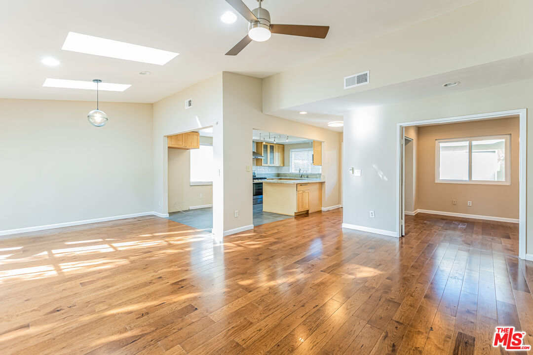 2 Tortoise Shell Irvine, CA 92604 - Photo 14 of 27 an empty room with wooden floor and windows