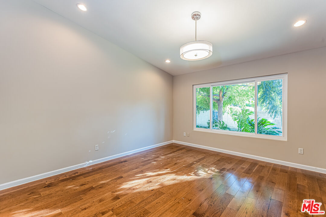 2 Tortoise Shell Irvine, CA 92604 - Photo 15 of 27 an empty room with wooden floor and windows