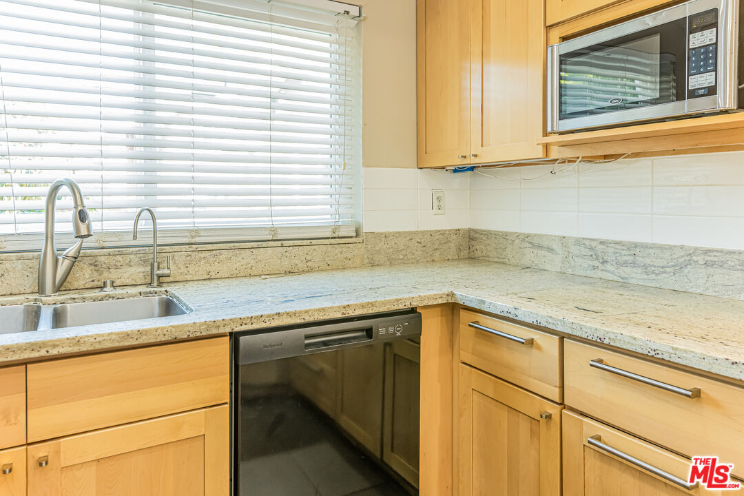 2 Tortoise Shell Irvine, CA 92604 - Photo 17 of 27 a kitchen with a sink and cabinets