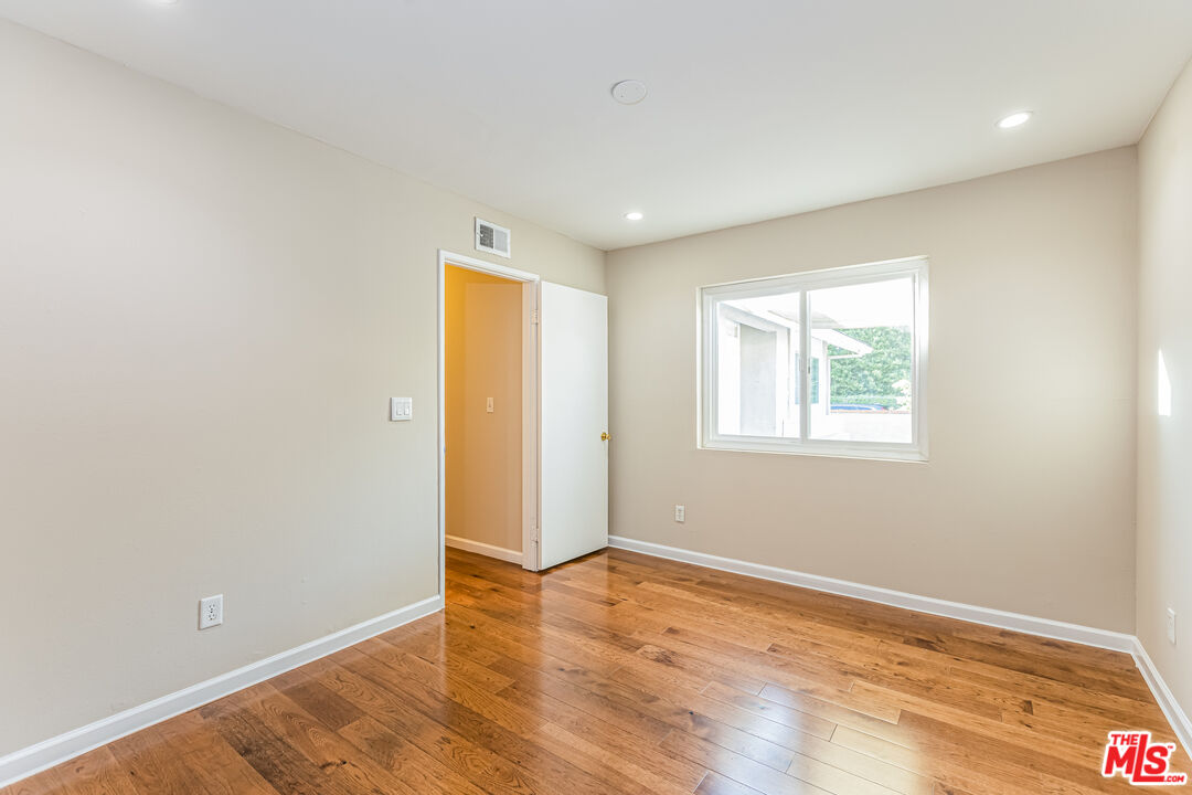 2 Tortoise Shell Irvine, CA 92604 - Photo 21 of 27 an empty room with wooden floor and windows