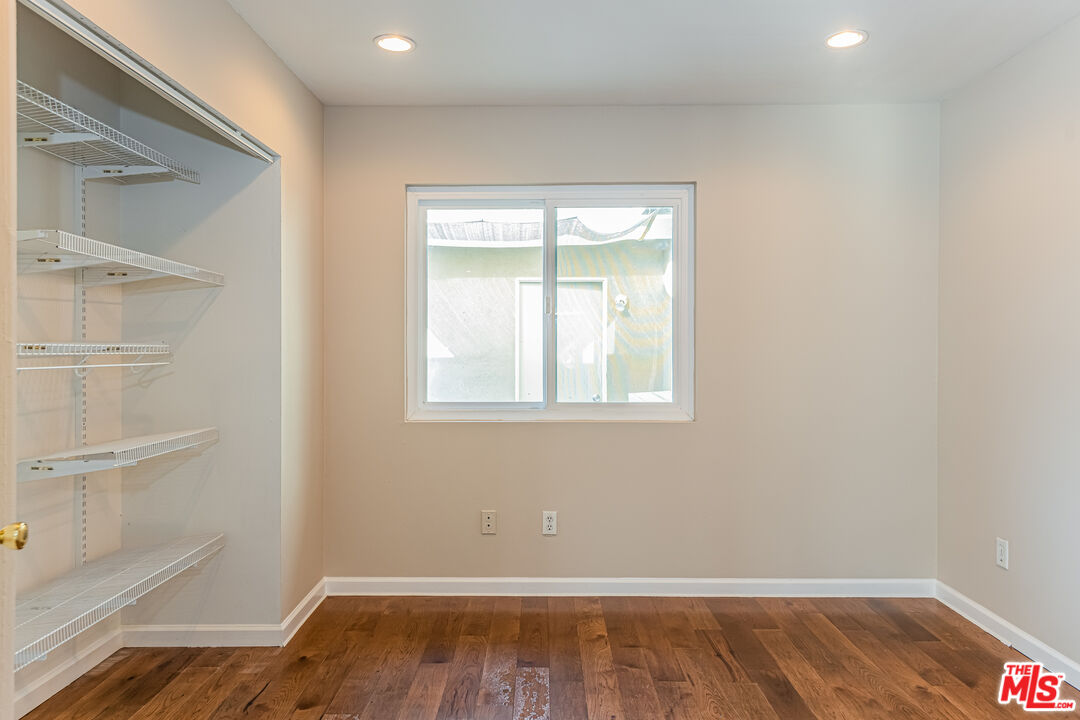 2 Tortoise Shell Irvine, CA 92604 - Photo 23 of 27 an empty room with wooden floor and a window