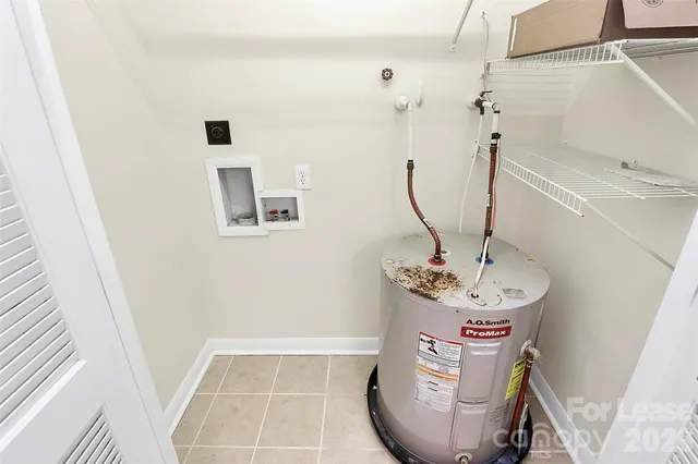 a view of a livingroom with sink dryer and washer