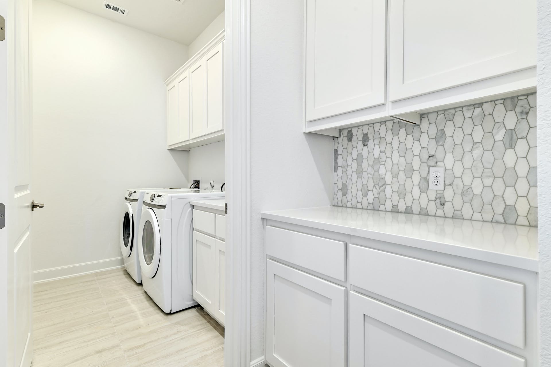 19005 Fernando Trail Austin, TX 78738 - Photo 30 of 35 Laundry area featuring cabinet space and washing machine and clothes dryer