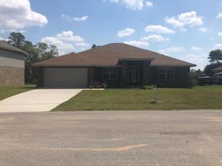 5760 Marigold Loop Crestview, FL 32539 - Photo 1 of 31 a view of a yard in front of a house