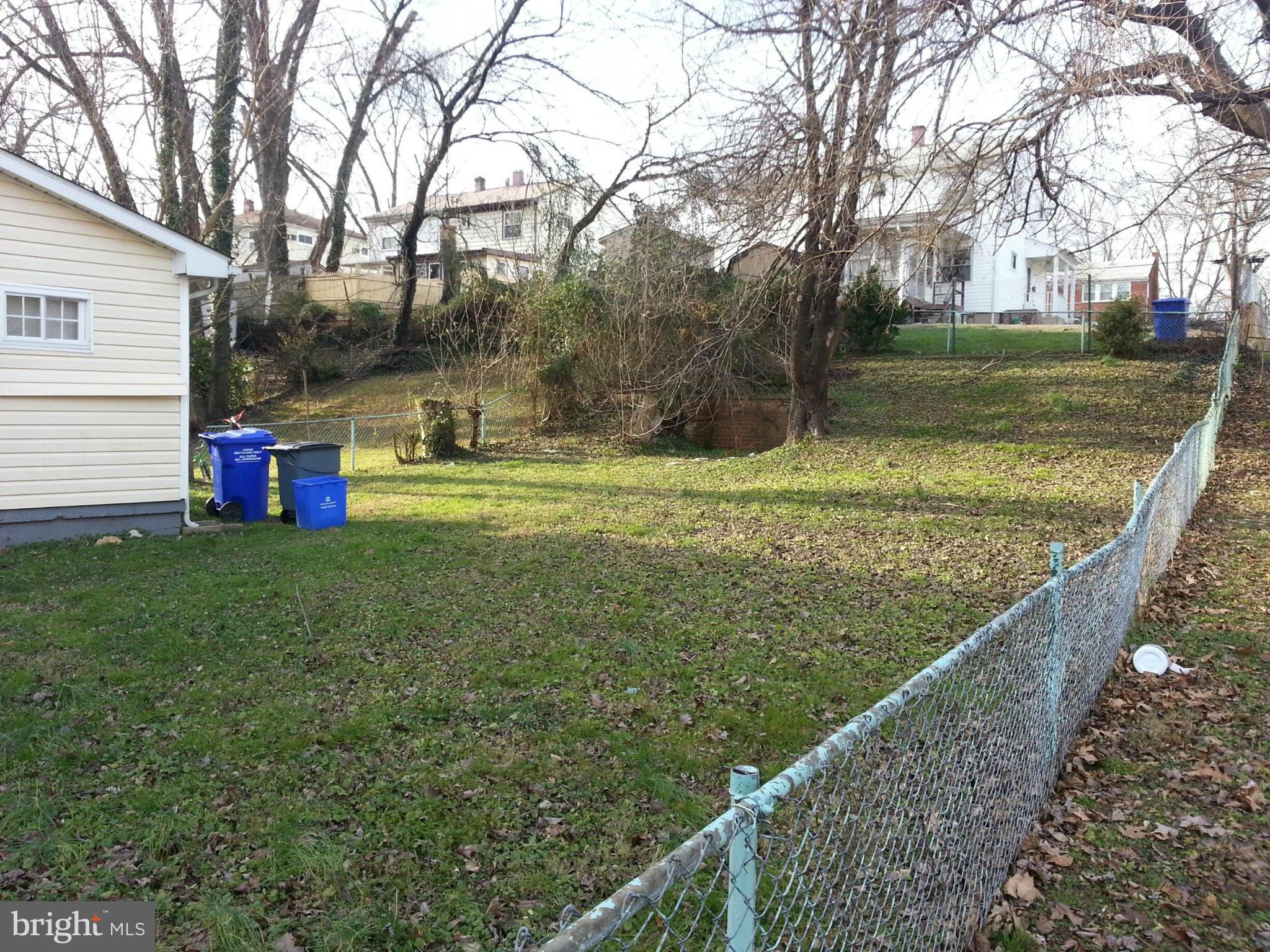 12130 Bluhill Road Silver Spring, MD 20902 - Photo 2 of 6 a view of a wooden deck and a yard