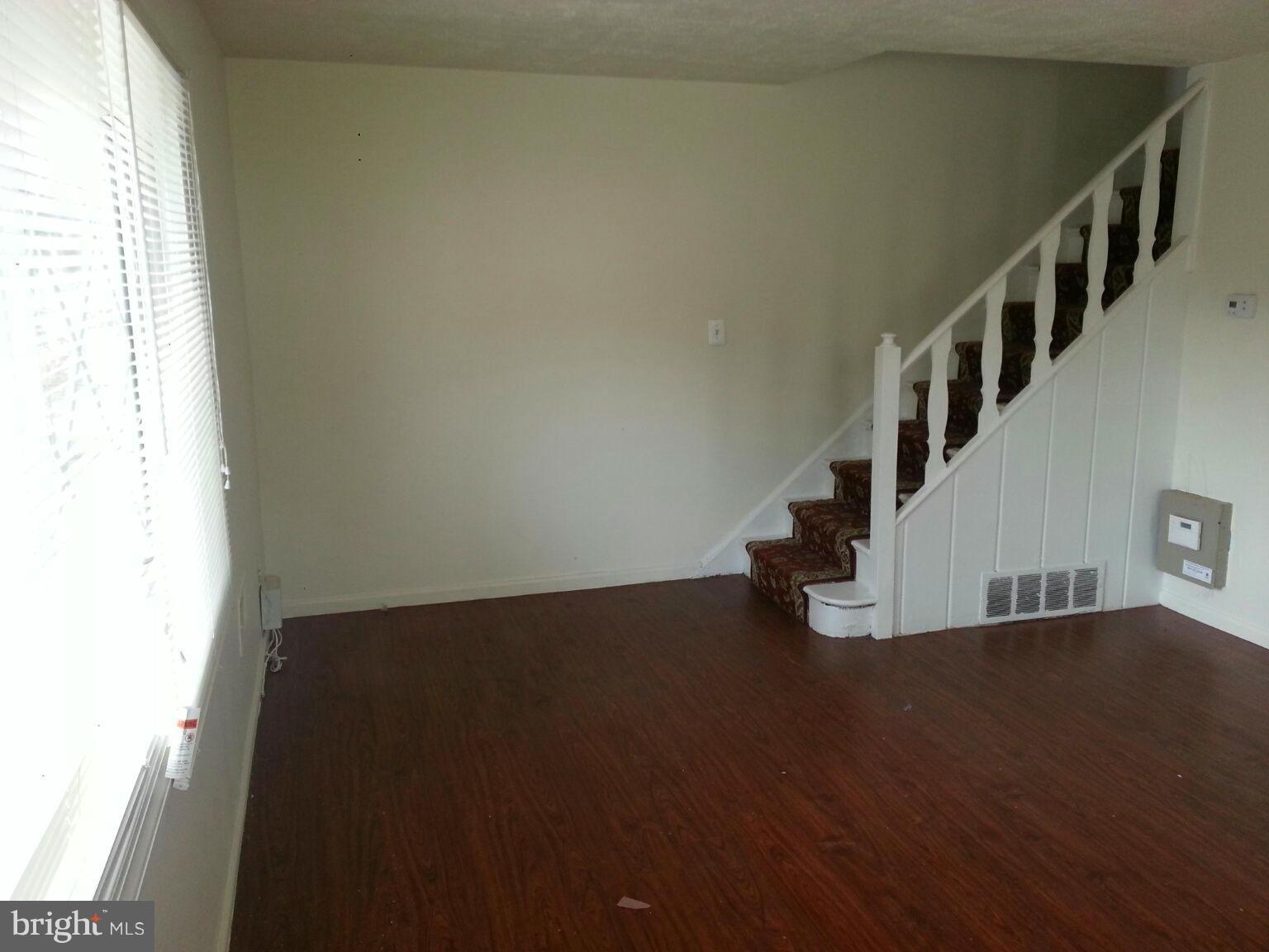 12130 Bluhill Road Silver Spring, MD 20902 - Photo 5 of 6 a view of entryway and hall with wooden floor