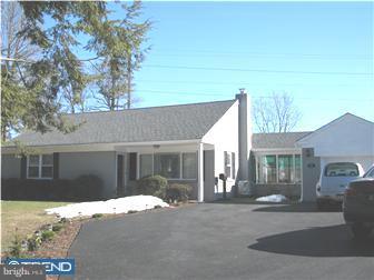1328 Providence Road Secane, PA 19018 - Photo 1 of 12 a front view of a house with a yard and garage