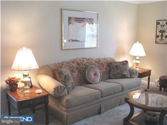 1328 Providence Road Secane, PA 19018 - Photo 3 of 12 a living room with furniture a lamp and a window