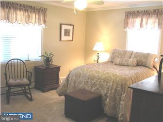 1328 Providence Road Secane, PA 19018 - Photo 8 of 12 a bedroom with a bed and lamps