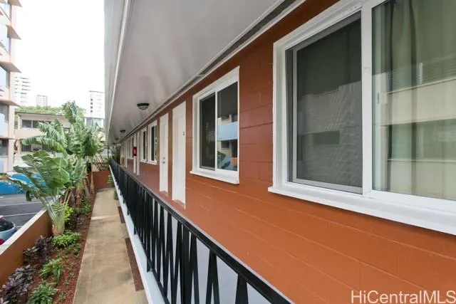 a view of balcony with furniture