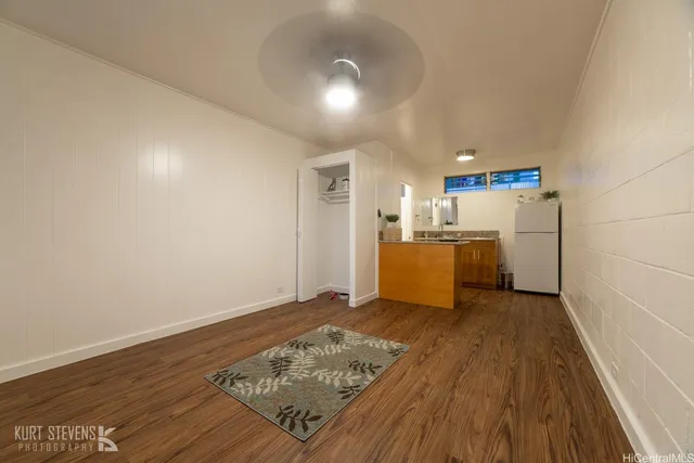 a view of a kitchen with wooden floor
