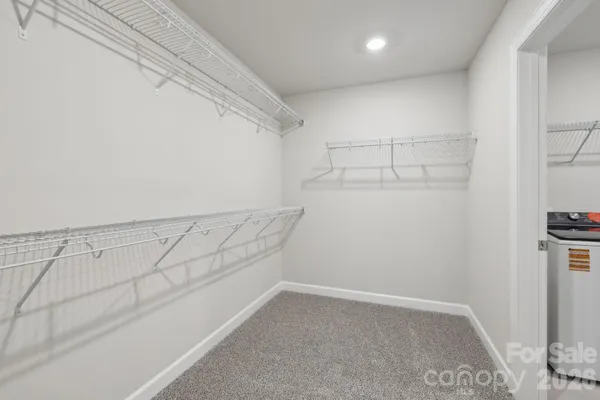 a view of a room with racks on the wall