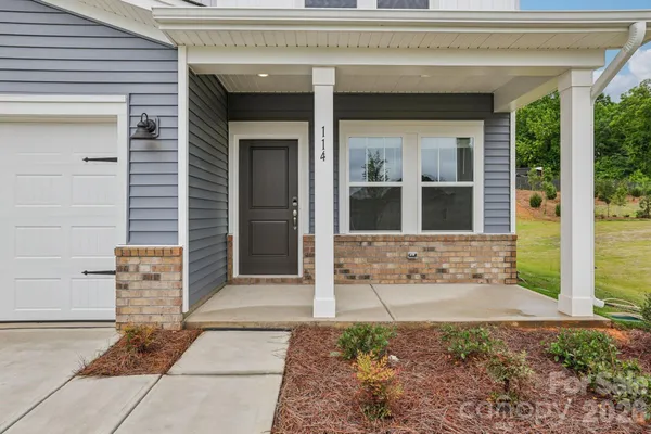 a view of a brick house with front door