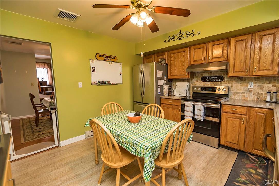 360 North 9th Street Bangor, PA 18013 - Photo 20 of 34 a dining room with a wooden table and chairs