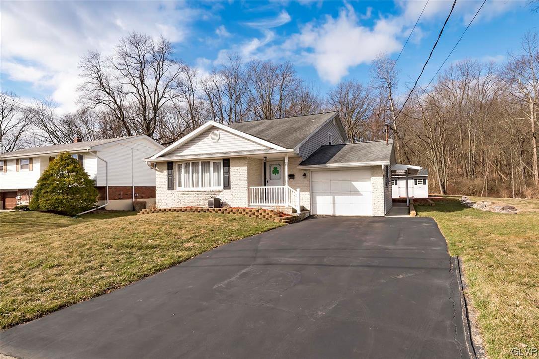 360 North 9th Street Bangor, PA 18013 - Photo 3 of 34 a front view of a house with a yard and garage
