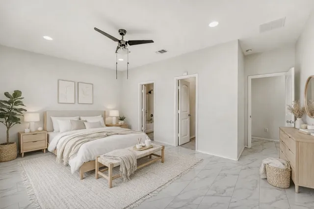 a view of a workspace with furniture and a potted plant
