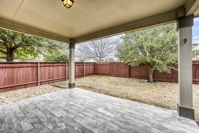 a view of backyard with green space